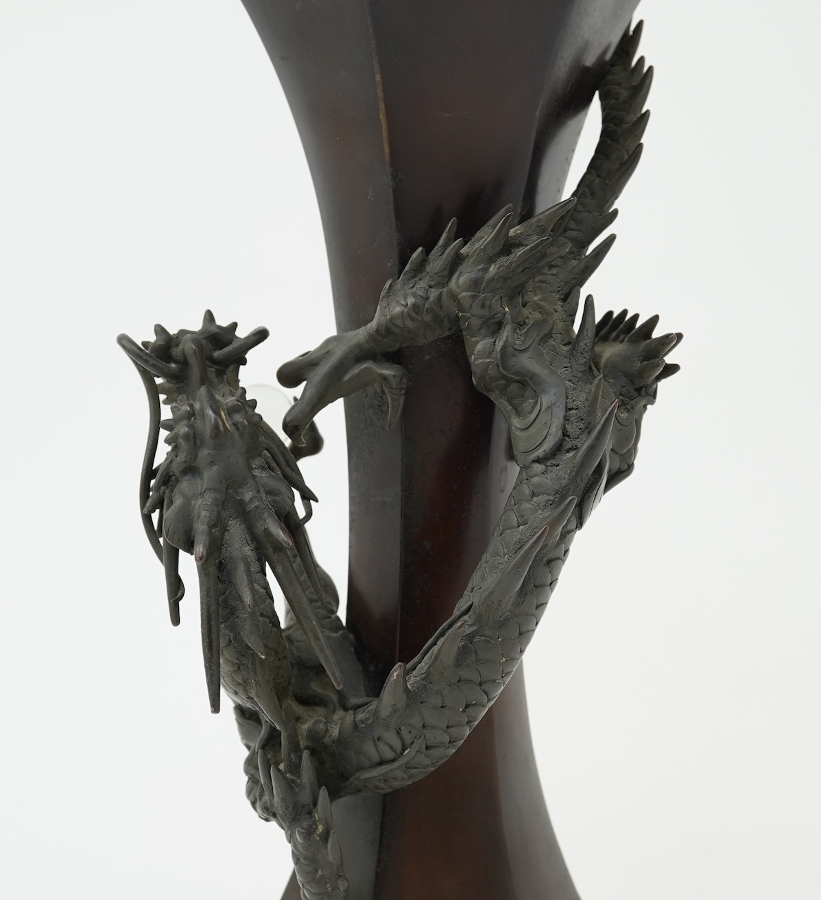 A Japanese bronze 'dragon' hexagonal beaker vase, Meiji period